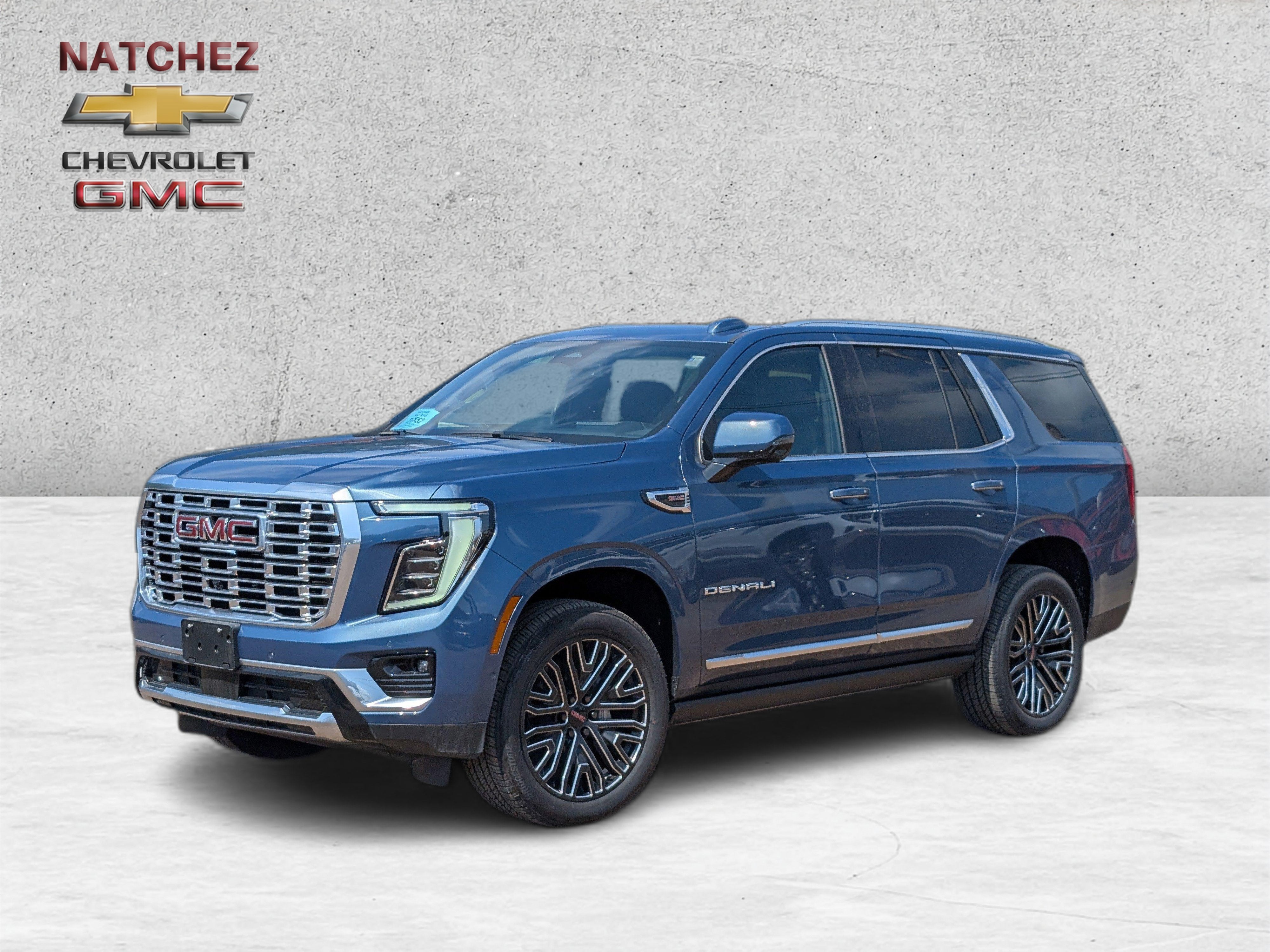 2026 GMC Yukon Denali in Downpour Metallic — front three-quarter view