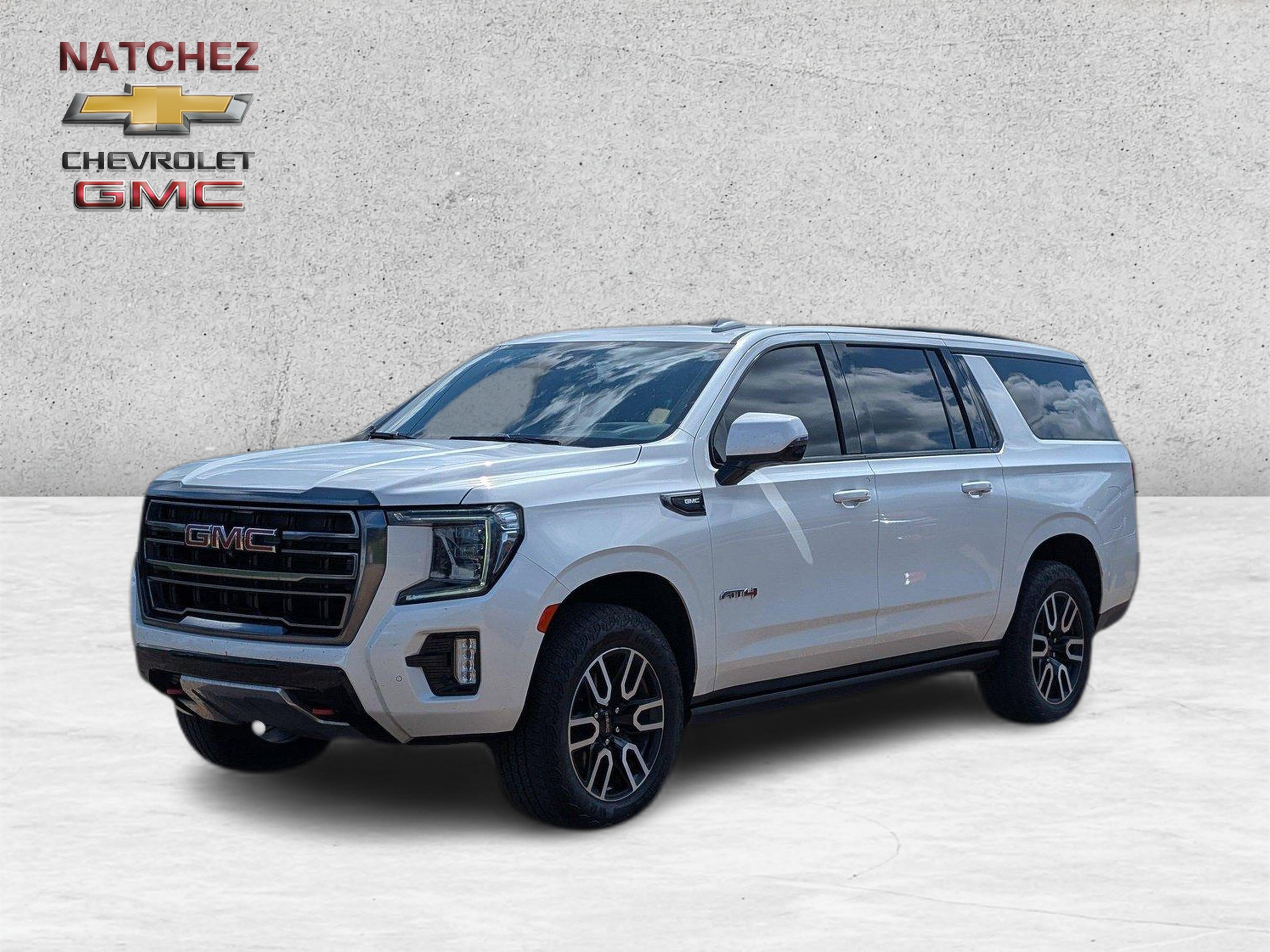 2023 GMC Yukon XL AT4 in White Frost Tricoat — front three-quarter view