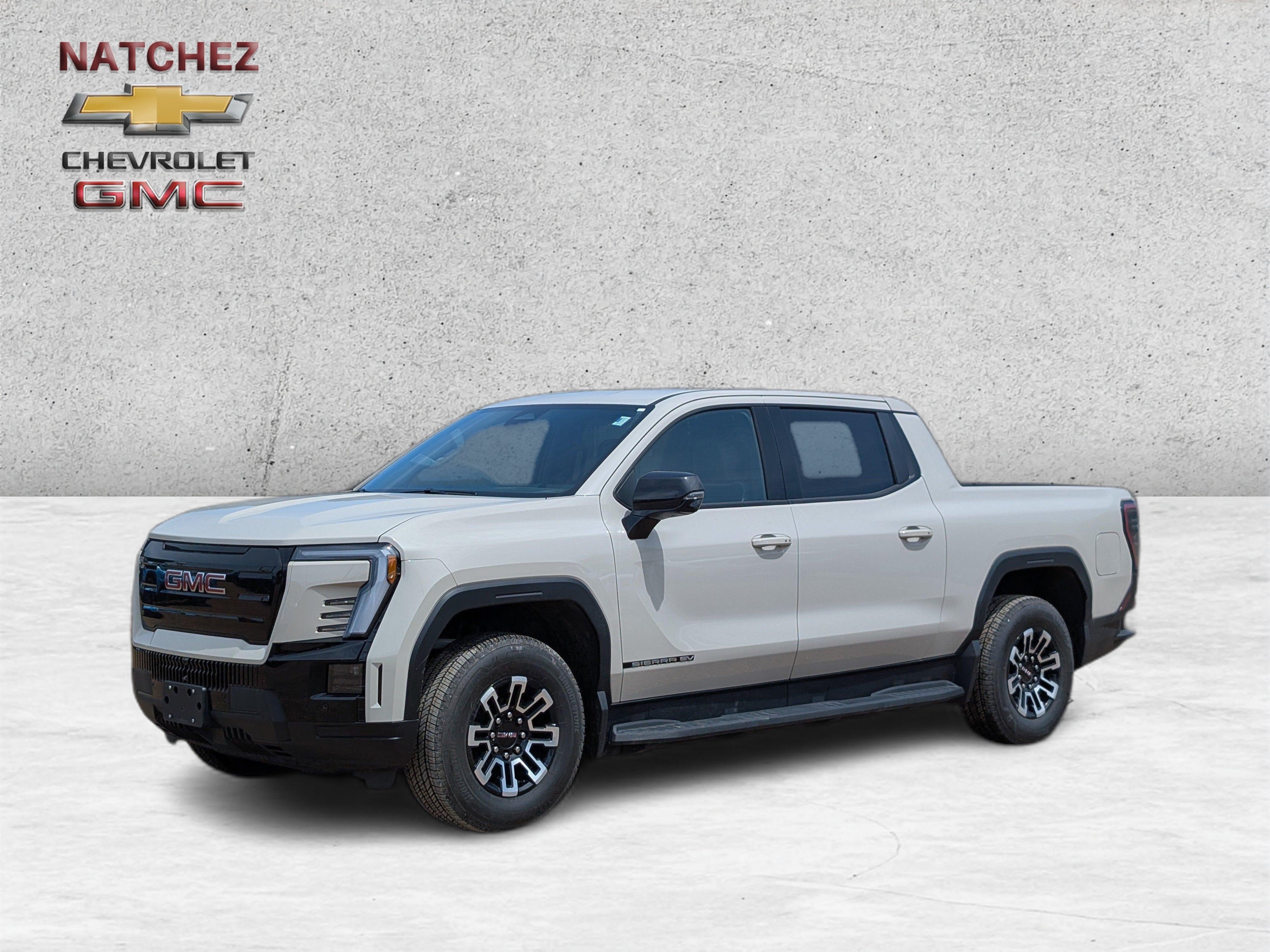 2026 GMC Sierra EV Elevation Extended Range in Coastal Dune — front three-quarter view
