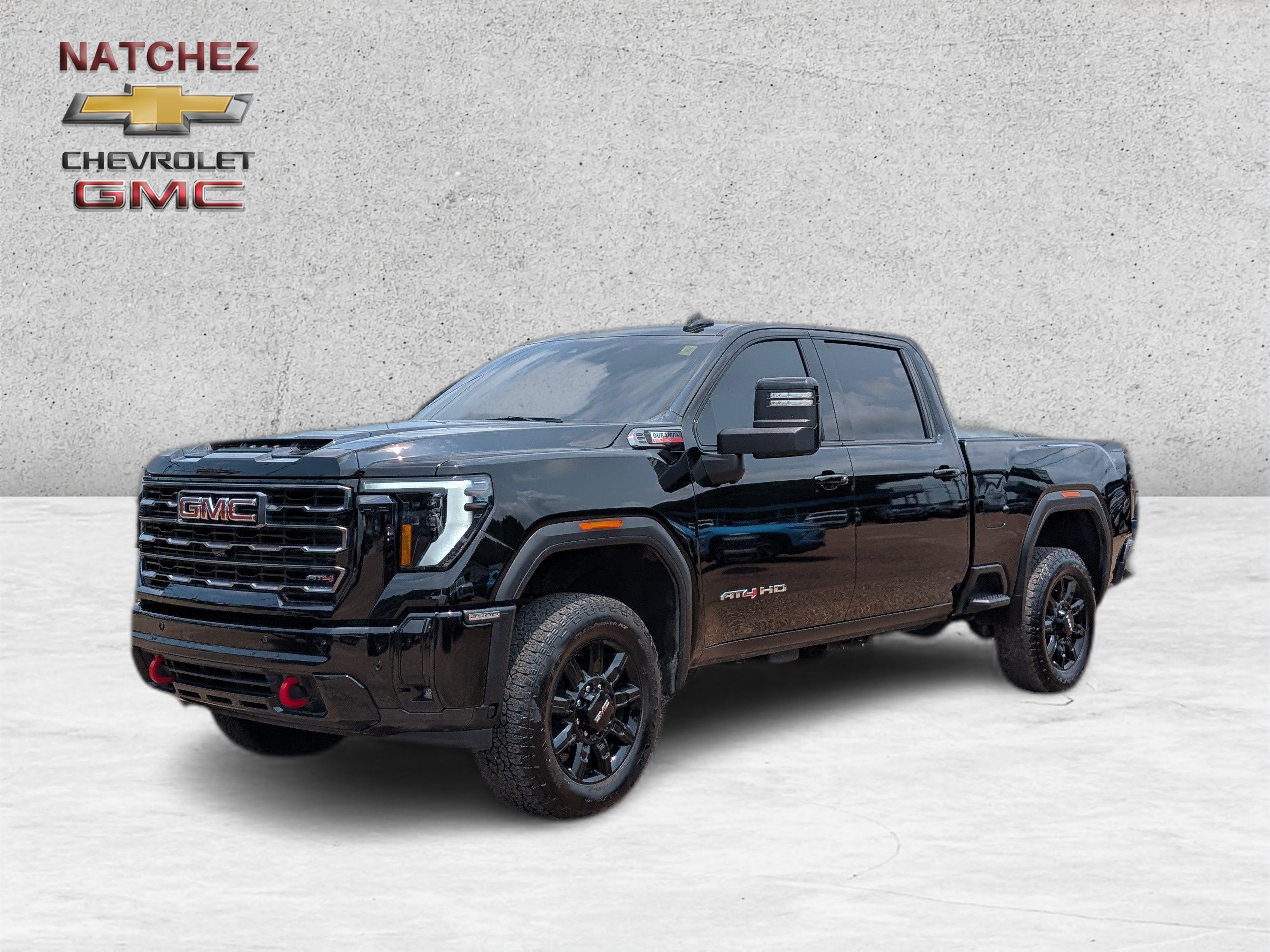 2025 GMC Sierra 2500 HD AT4 in Onyx Black — front three-quarter view