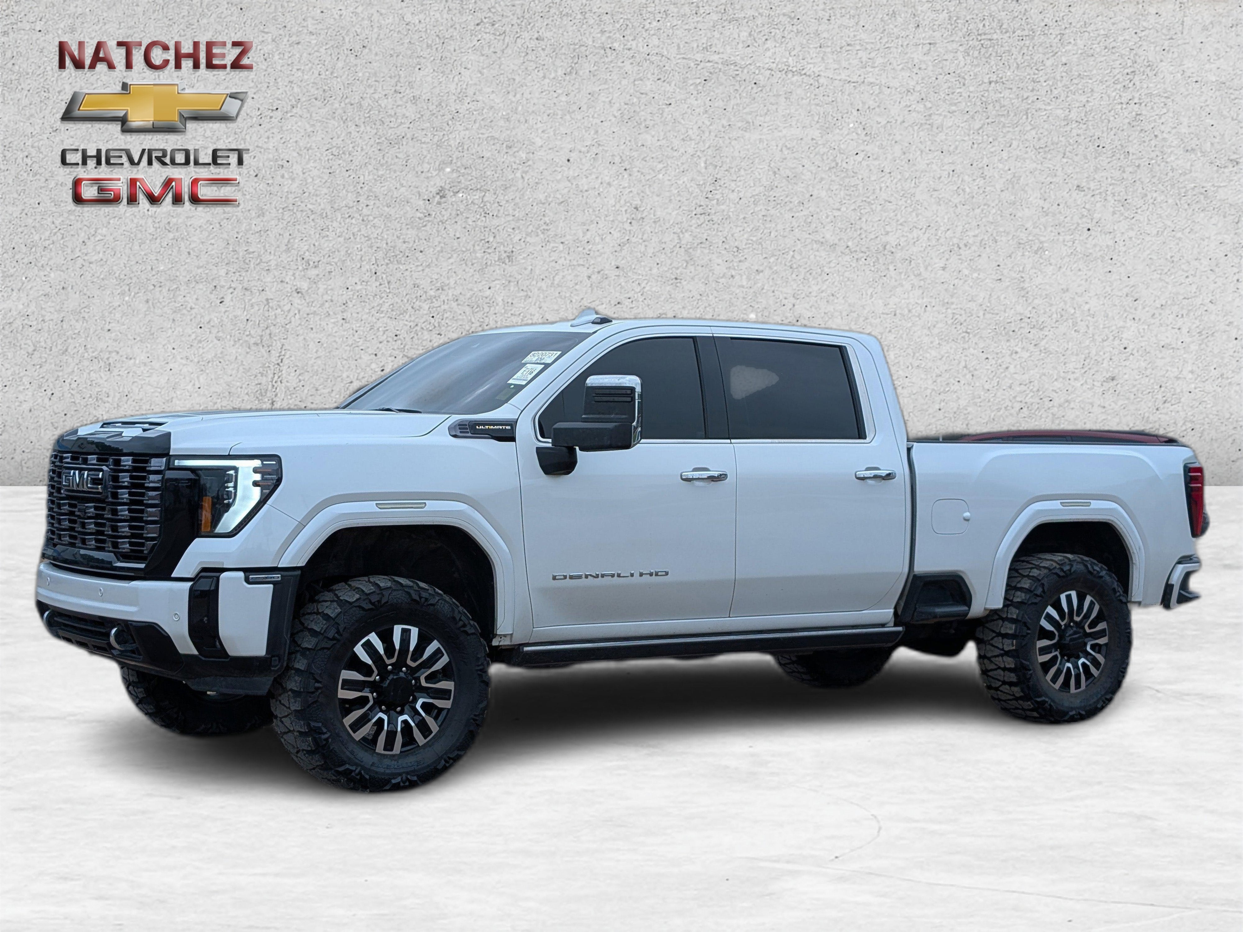 2025 GMC Sierra 2500 HD Denali Ultimate in White Frost Tricoat — front three-quarter view