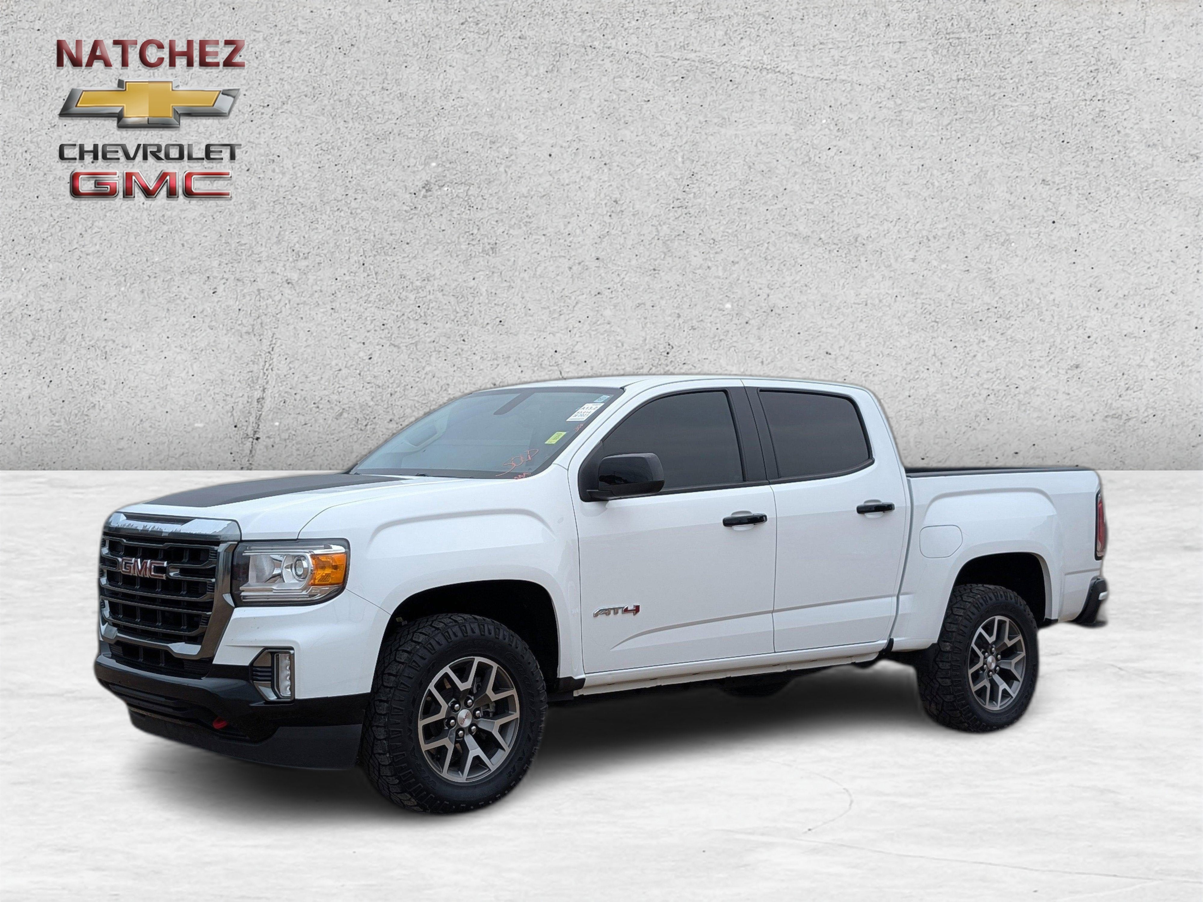 2021 GMC Canyon 4WD AT4 w/Cloth in Summit White — front three-quarter view
