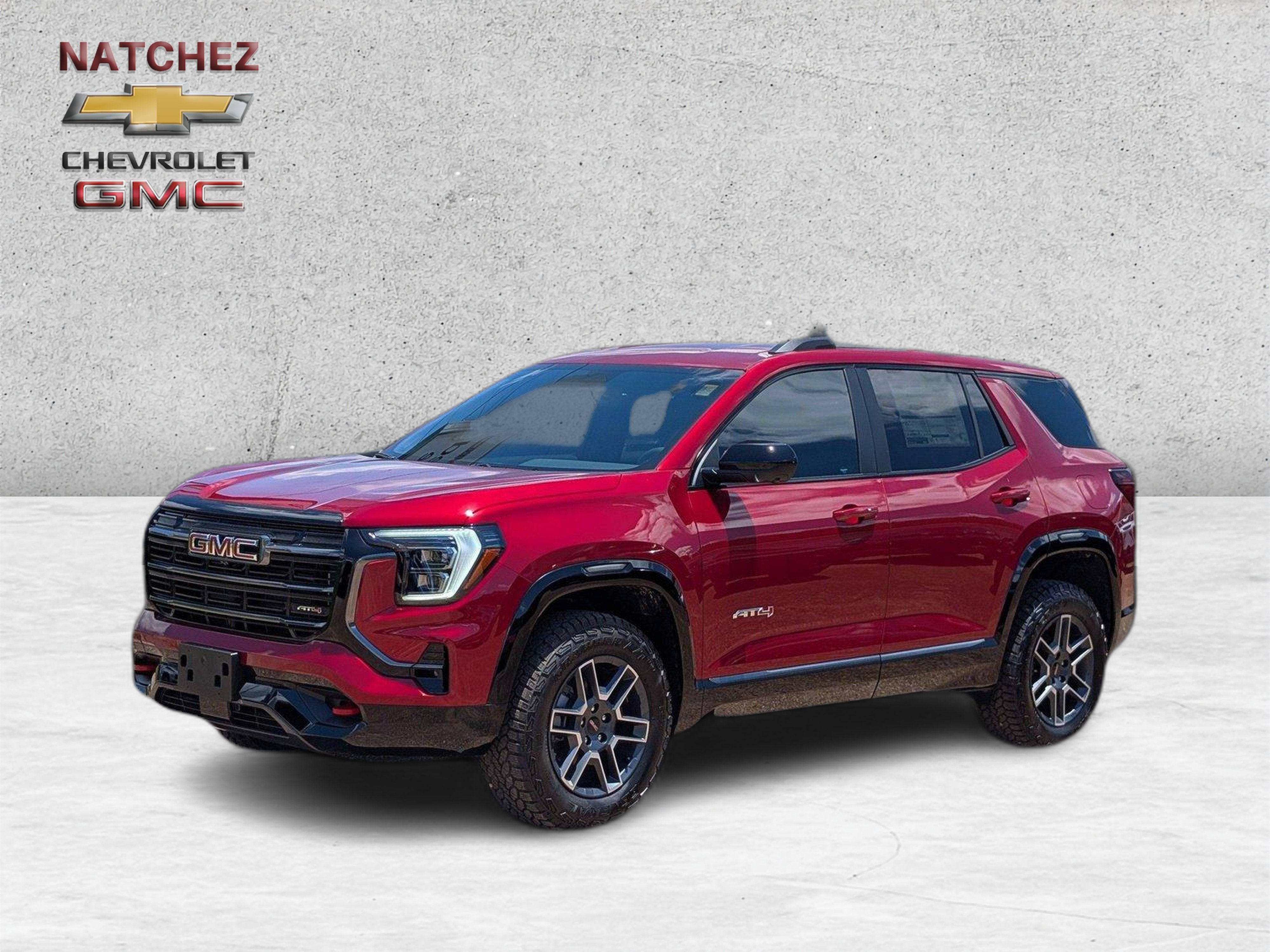 2026 GMC Terrain AT4 in Volcanic Red Tintcoat — front three-quarter view