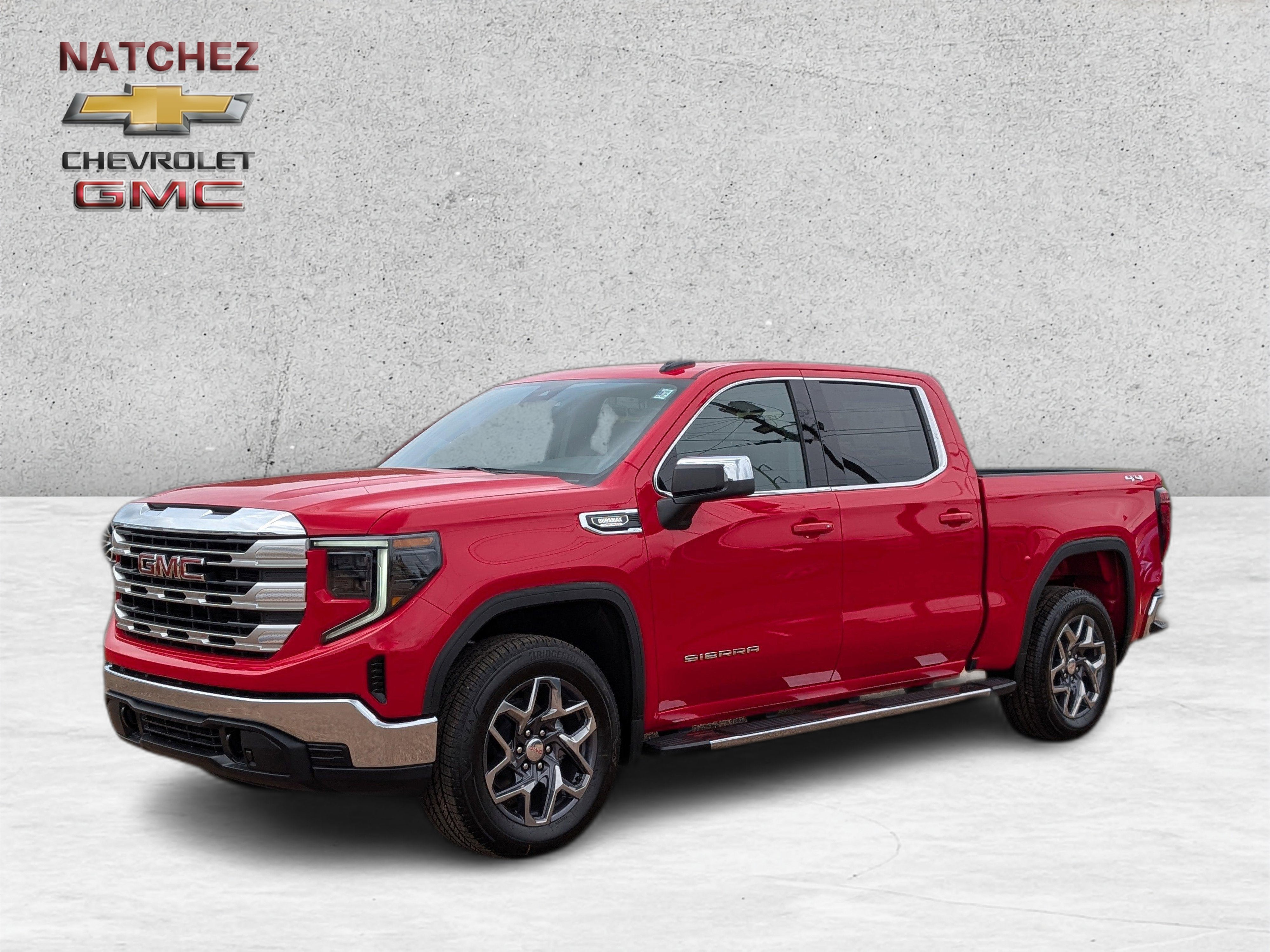 2026 GMC Sierra 1500 SLE in Cardinal Red — front three-quarter view