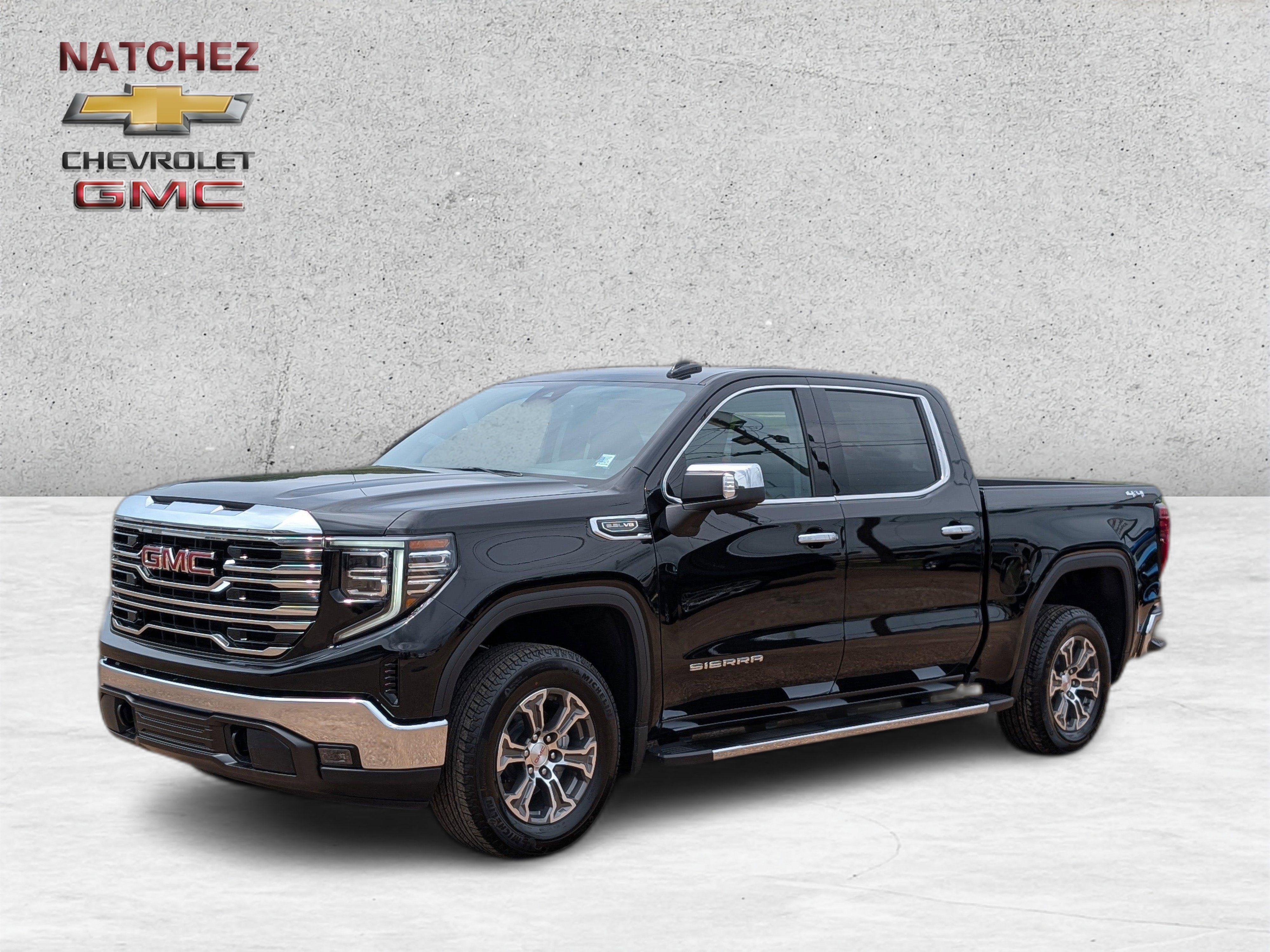 2026 GMC Sierra 1500 SLT in Onyx Black — front three-quarter view