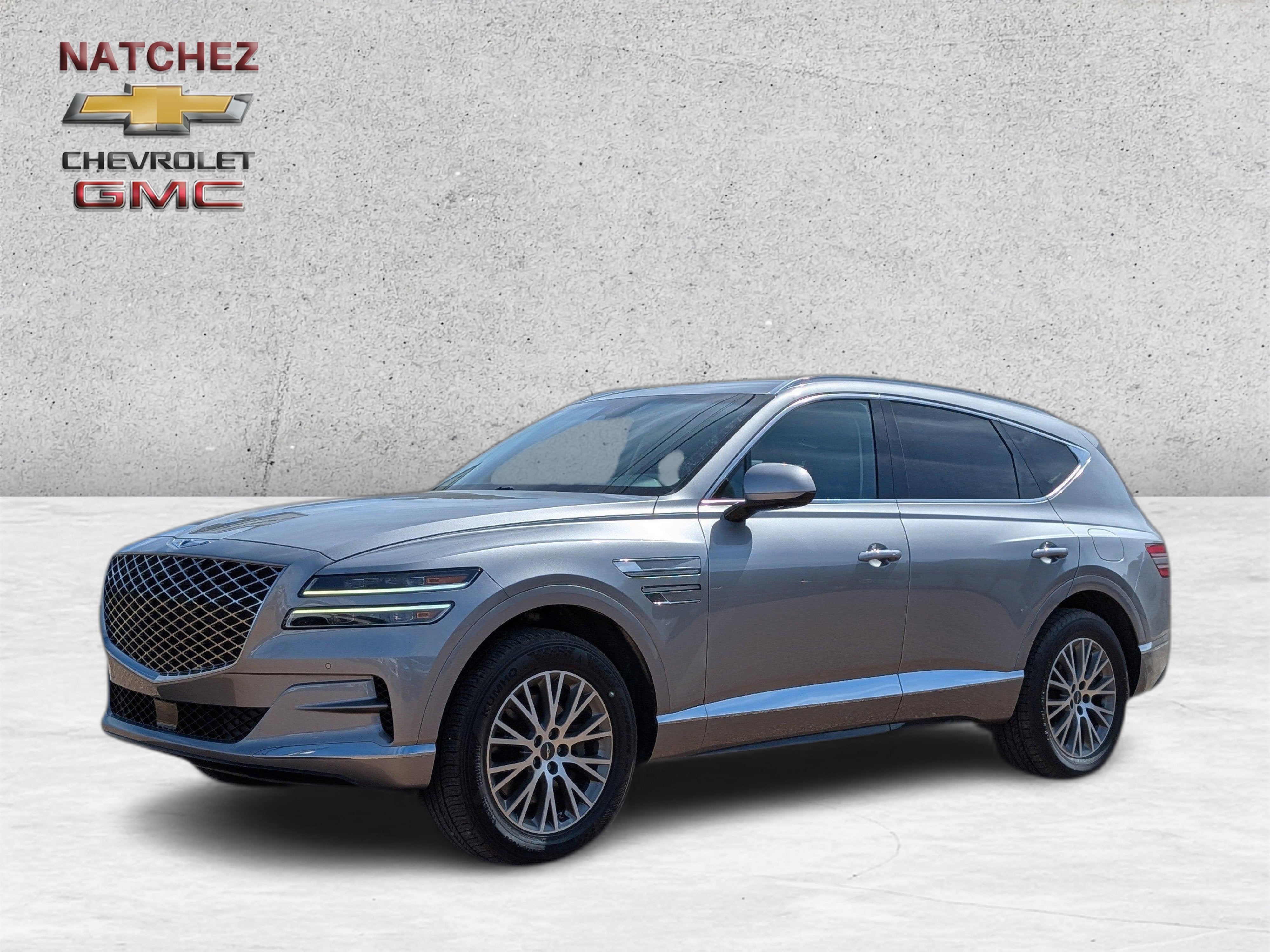 2024 Genesis GV80 NA in Silver — front three-quarter view